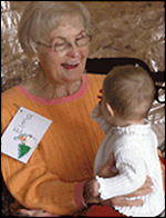 photo of senior with baby on her lap